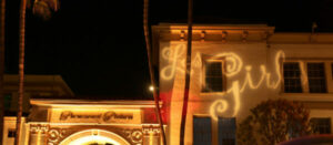 NBCC's Les Girls event at Paramount Studios, Hollywood. The Paramount Pictures arch is visible, and the Les Girls logo is projected on a studio building.